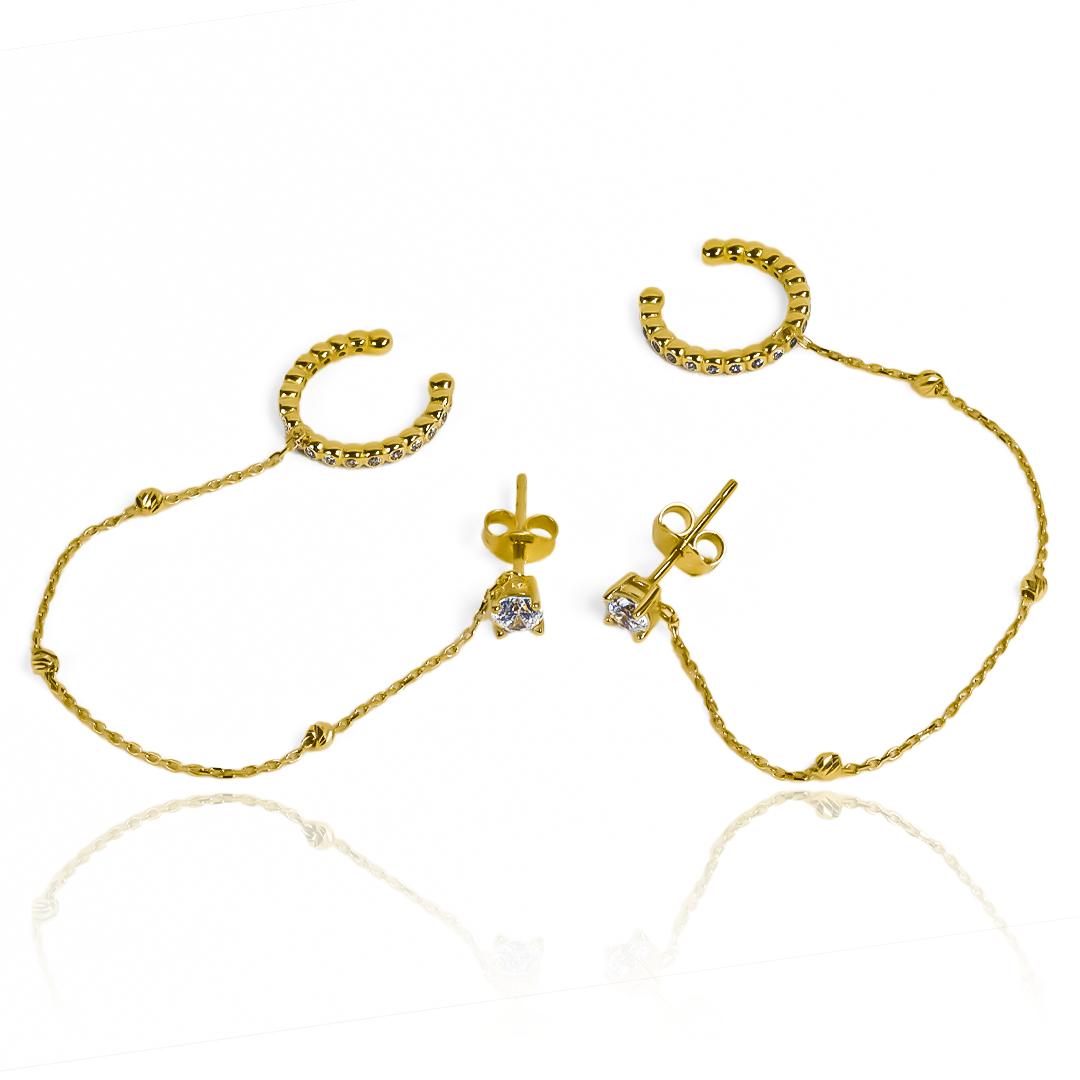 Descubra la elegancia y exclusividad con nuestros Aretes Topo + Earcuff I en Oro 18K. Parte de la exclusiva Joyería Caracas, estos aretes garantizan calidad y sofisticación, con una garantía de por vida. Lleve su estilo al siguiente nivel con estos impresionantes aretes.