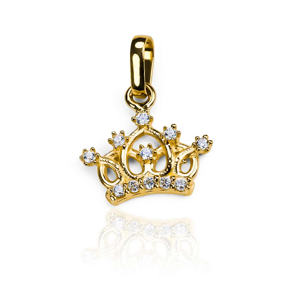 Completa tu estilo con elegancia con el Dije Corona inglesa JT. Hecho de oro 18K y con la garantía de Joyería Caracas para toda la vida. Una joya de lujo que te acompaña en cada momento.