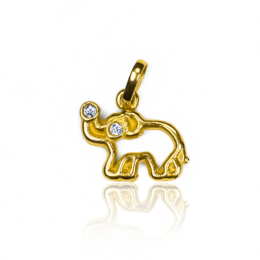 Déjate encantar por la exclusividad y elegancia del Dije Elefante JT. Su diseño en Oro 18K lo convierte en una joya única de Joyería Caracas. Además, cuenta con una garantía para toda la vida, asegurando su calidad y durabilidad. Una pieza imprescindible para los amantes de la sofisticación.