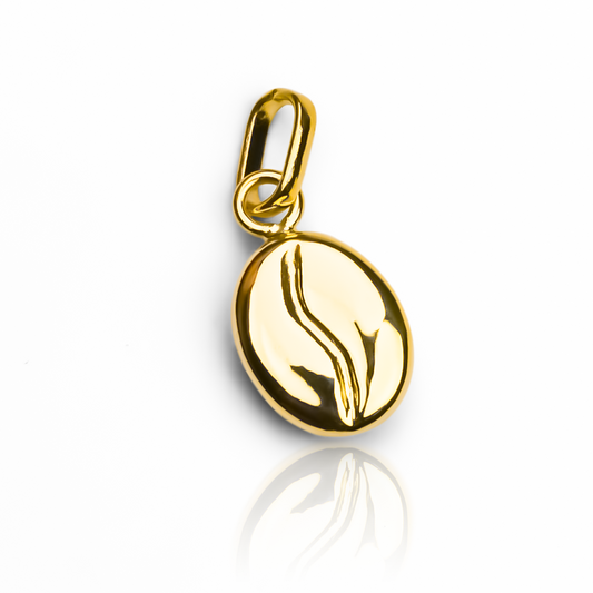 Elegante y exclusivo dije de grano de café en oro 18K de la reconocida joyería Caracas. Garantía de por vida para una joya de calidad premium. Eleva tu estilo con este símbolo de lujo y sofisticación. Perfecto para cualquier ocasión.