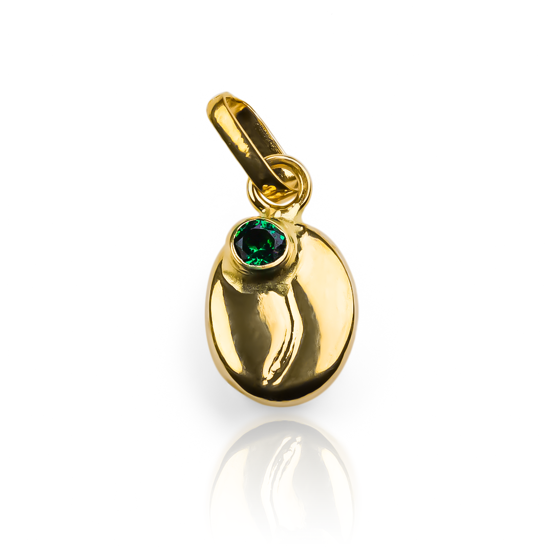 Agregue un toque de elegancia con el dije Grano de café M cristal green JT. De oro 18K y con la exclusividad de Joyería Caracas. Con garantía de por vida, será una pieza única y duradera en su colección.