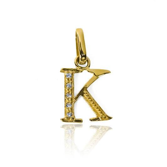 Destaque con estilo usando nuestro Dije Letra K cristales JC en oro 18K. Nuestra Joyería Caracas te ofrece una garantía para toda la vida. Expresa tu personalidad con este exclusivo accesorio que refleja elegancia y calidad. ¡Haz una declaración de sofisticación con cada movimiento!