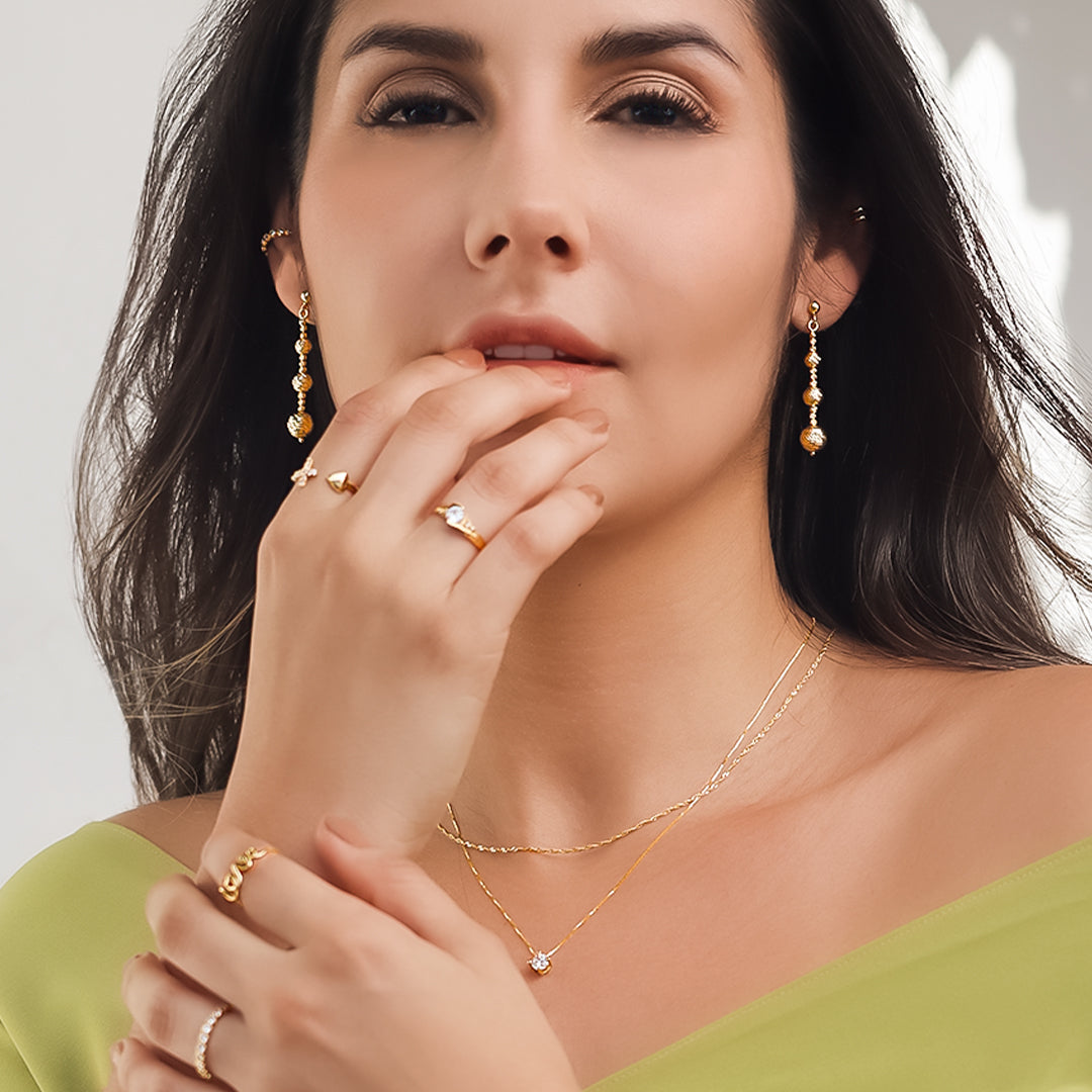 Dije pasante #4, elaborado con oro de 18K, de la exclusiva Joyería Caracas. Con garantía para toda la vida, este elegante dije representa un símbolo de lujo y sofisticación en tu joyero.