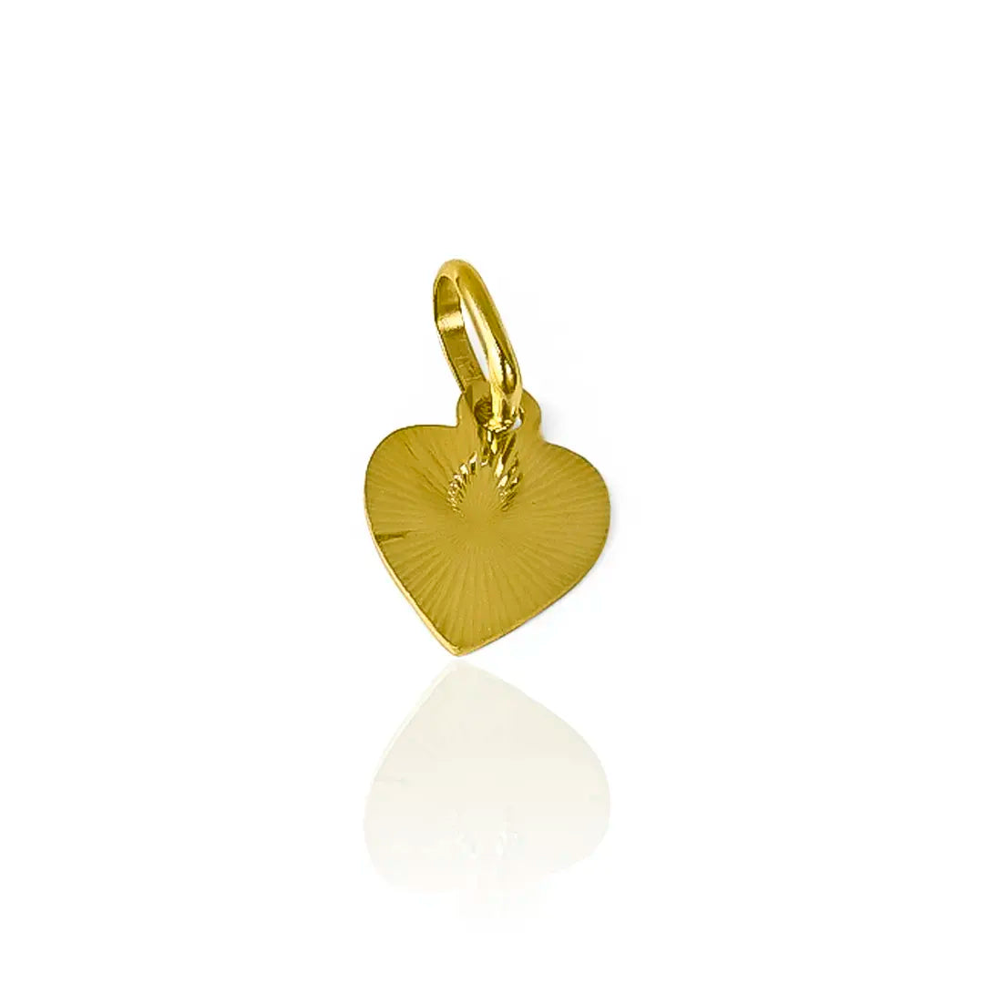 Dije corazón diamantado placa I en oro 18k. Este hermoso accesorio de Joyería Caracas y cuenta con garantía para toda la vida.