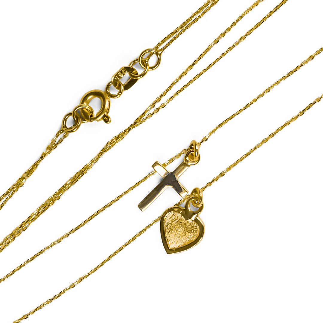 La gargantilla Cross &amp; Heart es una pieza de joyería de alta calidad bañada en oro de 18K. Diseñada por Joyería Caracas, esta elegante gargantilla es el complemento perfecto para cualquier atuendo, brindando un toque sofisticado y exclusivo. Con garantía de por vida, es una inversión que durará para siempre.