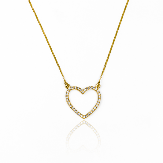 Luce sofisticada con la Gargantilla Mini cubana - Corazón JT de oro 18K de Joyería Caracas. Esta pieza exclusiva ofrece una garantía de por vida, asegurando su calidad y durabilidad. Realza tu elegancia con un toque de arte y lujo en tu colección de joyería.