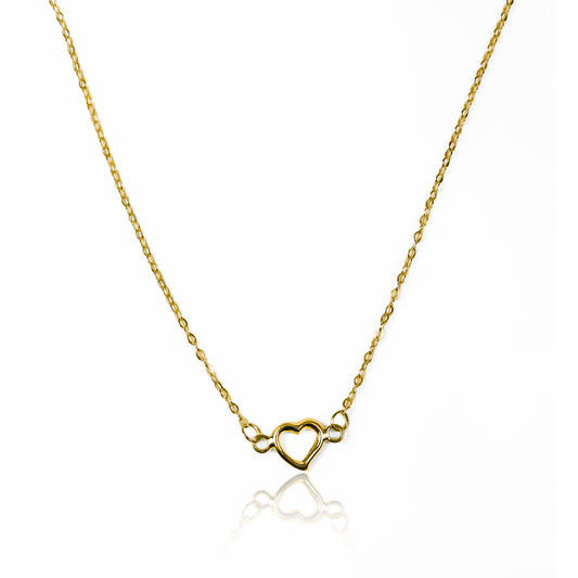 La gargantilla corazón en oro 18K de Joyería Caracas es una pieza de lujo que te acompañará de por vida. Con un diseño elegante y exclusivo, esta gargantilla es un símbolo de amor y elegancia. Descubre su belleza y crea un look sofisticado con esta joya única. ¡Garantía de por vida incluida!