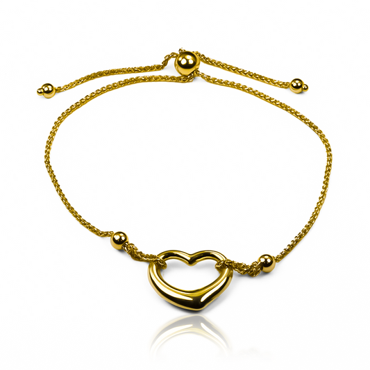 Experimenta un estilo lujoso con nuestra Pulsera Corazón I. Hecha de Oro 18K por Joyería Caracas, su elegante diseño simboliza amor y pasión. Con garantía para toda la vida, es el regalo perfecto que perdurará por siempre.