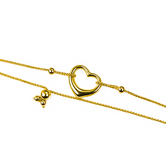 Experimenta un estilo lujoso con nuestra Pulsera Corazón I. Hecha de Oro 18K por Joyería Caracas, su elegante diseño simboliza amor y pasión. Con garantía para toda la vida, es el regalo perfecto que perdurará por siempre.