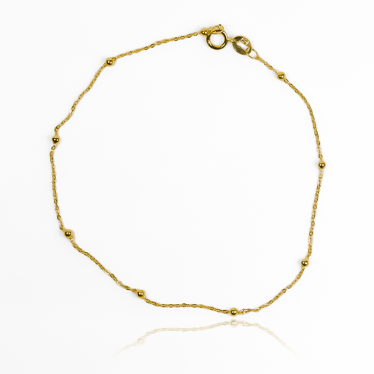 Lujo y elegancia se unen en nuestra Pulsera Esferas lisas I. Hecha de oro 18K por los expertos de Joyería Caracas, es el complemento perfecto para cualquier ocasión. Con garantía para toda la vida, esta pulsera es una inversión en calidad y estilo.