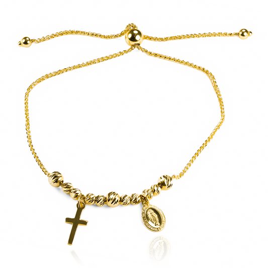 La pulsera Guadalupe cruz, hecha con delicado oro de 18K, es una joya exclusiva de Joyería Caracas. Con su garantía de por vida, es la elección perfecta para destacar tu elegancia y estilo, convirtiéndote en una referente de la moda y la sofisticación.