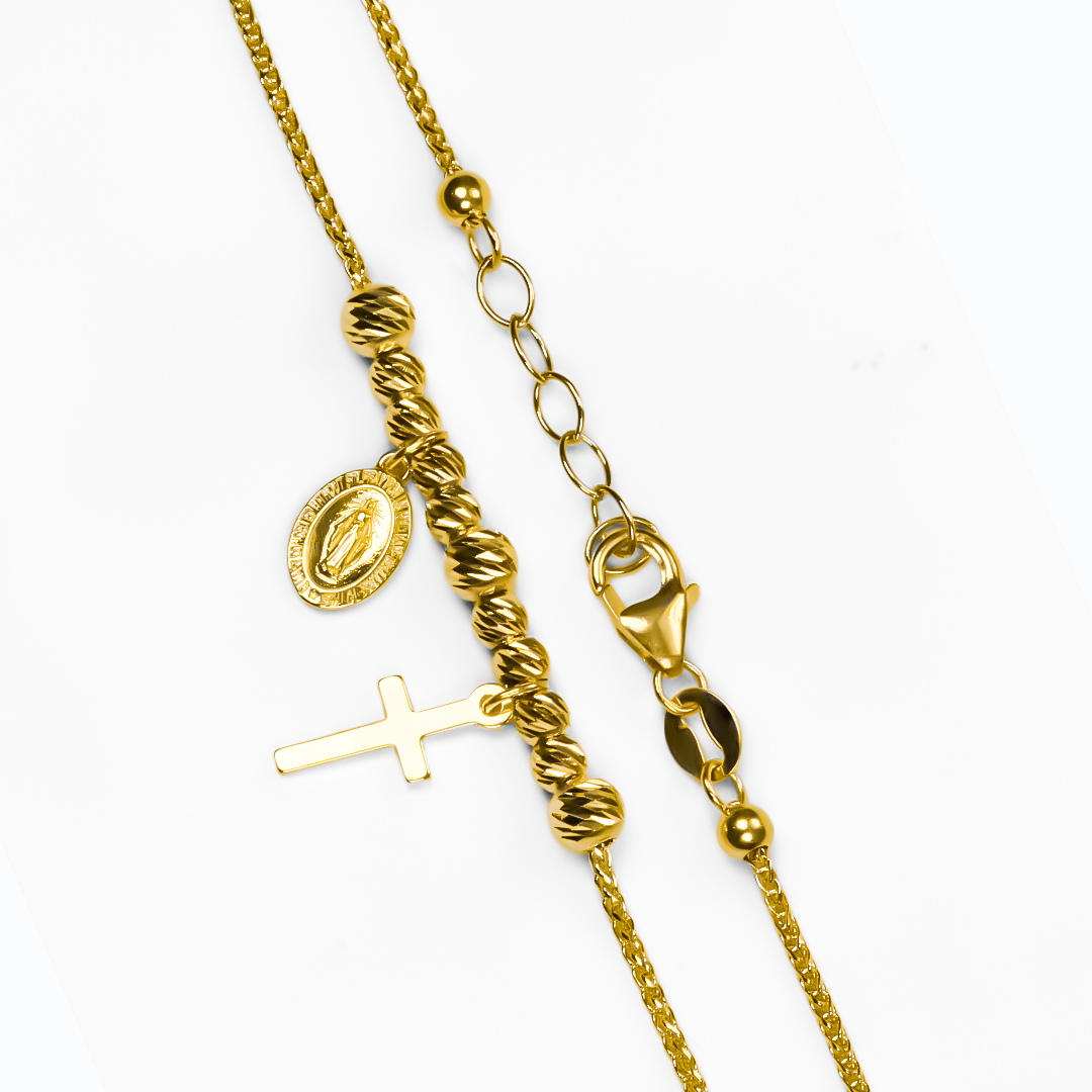 Luce esta exquisita y elegante Pulsera Guadalupe cruz I, diseñada con Oro 18K de la prestigiosa Joyería Caracas. Con su icónico diseño de la cruz, esta pulsera es una declaración de estilo y devoción. Además, cuenta con garantía para toda la vida, asegurando su durabilidad y calidad excepcional.