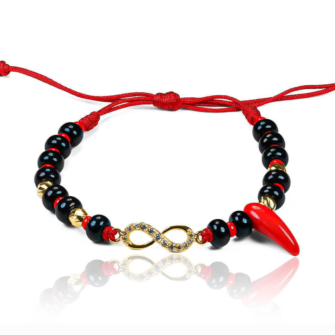 Descubre la elegancia eterna con nuestra Pulsera Infinito Azabaches +Esferas #4 en Oro 18K. Hecha por Joyería Caracas, esta pulsera es una pieza de lujo garantizada para toda la vida. Completa tu estilo con este símbolo de infinito y belleza exclusiva.