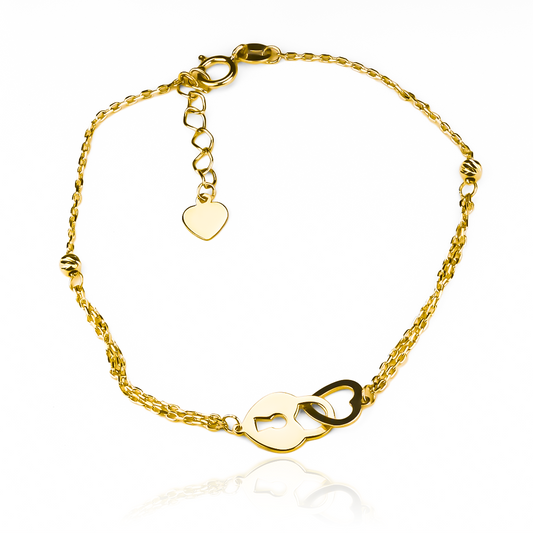 Esta pulsera de Oro 18K de Joyería Caracas con un hermoso diseño de corazón candado I no solo adornará tu muñeca con elegancia, sino que también es garantía de calidad de por vida. Haz una declaración de estilo con esta pieza exclusiva y lujosa.