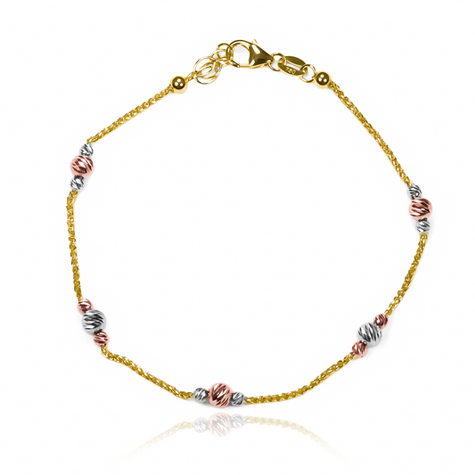 Descubre la elegancia y exclusividad de nuestra Pulsera cordón esferas facetadas 3 oros I. Hecha de oro 18K y creada por Joyería Caracas, esta pulsera te ofrece garantía para toda la vida. Luce sofisticada y resalta en cualquier ocasión con esta hermosa pieza de joyería.