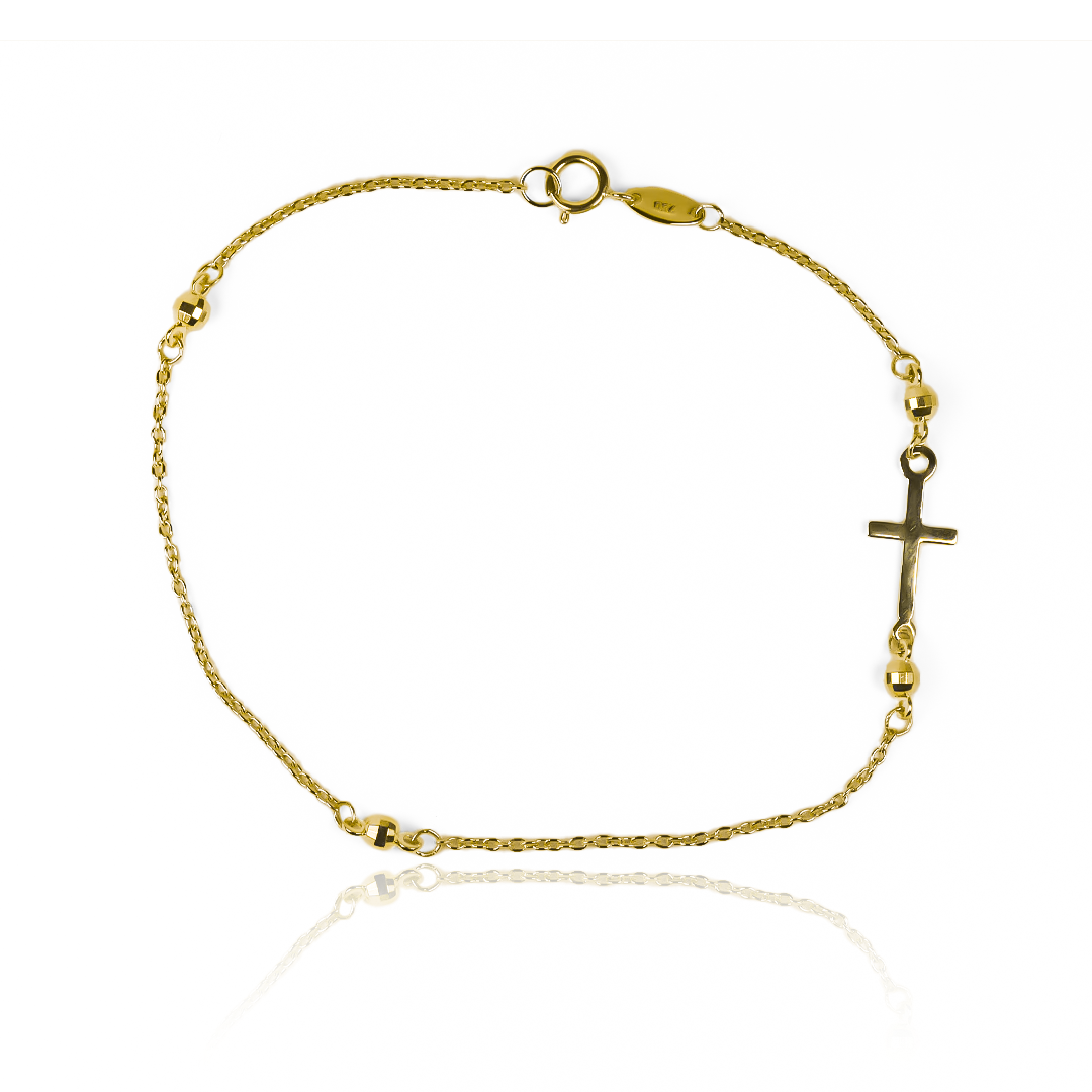 Descubra la elegancia y exclusividad de nuestra Pulsera cruz + esferas de oro 18K de Joyería Caracas, con garantía para toda la vida. Un toque de sofisticación que perdurará para siempre en su colección de lujo.