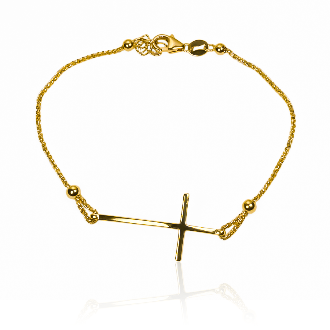 Disfruta de la elegancia y exclusividad con nuestra pulsera cruz+esferas I de oro 18K de Joyería Caracas. Con garantía para toda la vida, esta pieza es una verdadera joya para complementar tu estilo. Haz una declaración de buen gusto y sofisticación con esta pulsera única.