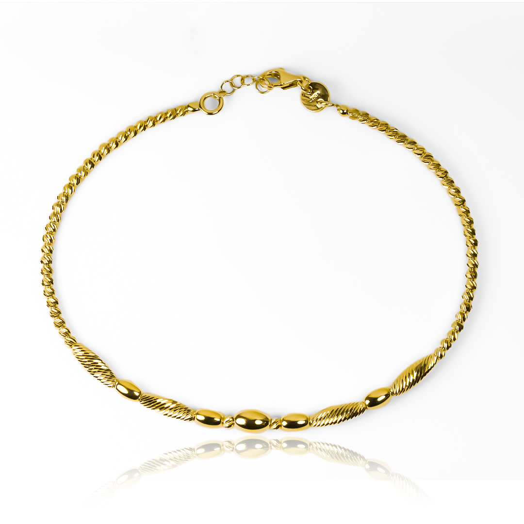 Esta pulsera guaya capullo I, de oro 18K, es una joya exclusiva de la prestigiosa Joyería Caracas. Con garantía para toda la vida, esta pulsera es el símbolo perfecto de elegancia y distinción. Cada vez que la lleves puesta, sentirás la calidad y el lujo de los mejores materiales y diseño.