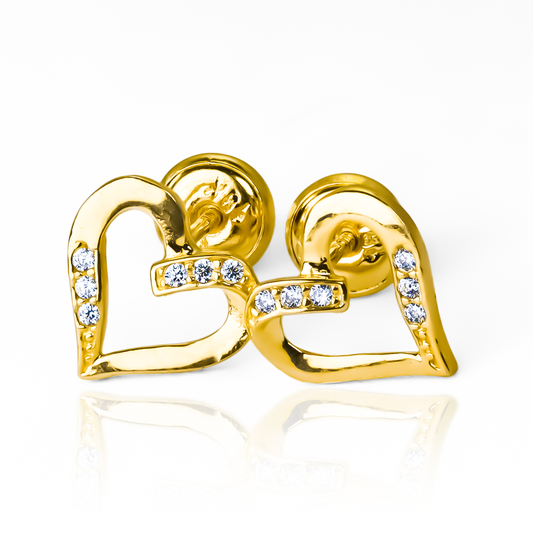 Disfruta de la elegancia y exclusividad de los Topitos Corazones franceses en oro 18K de Joyería Caracas. Con garantía de por vida, es la elección perfecta para un regalo especial. Déjate enamorar por su encanto y calidad atemporal.