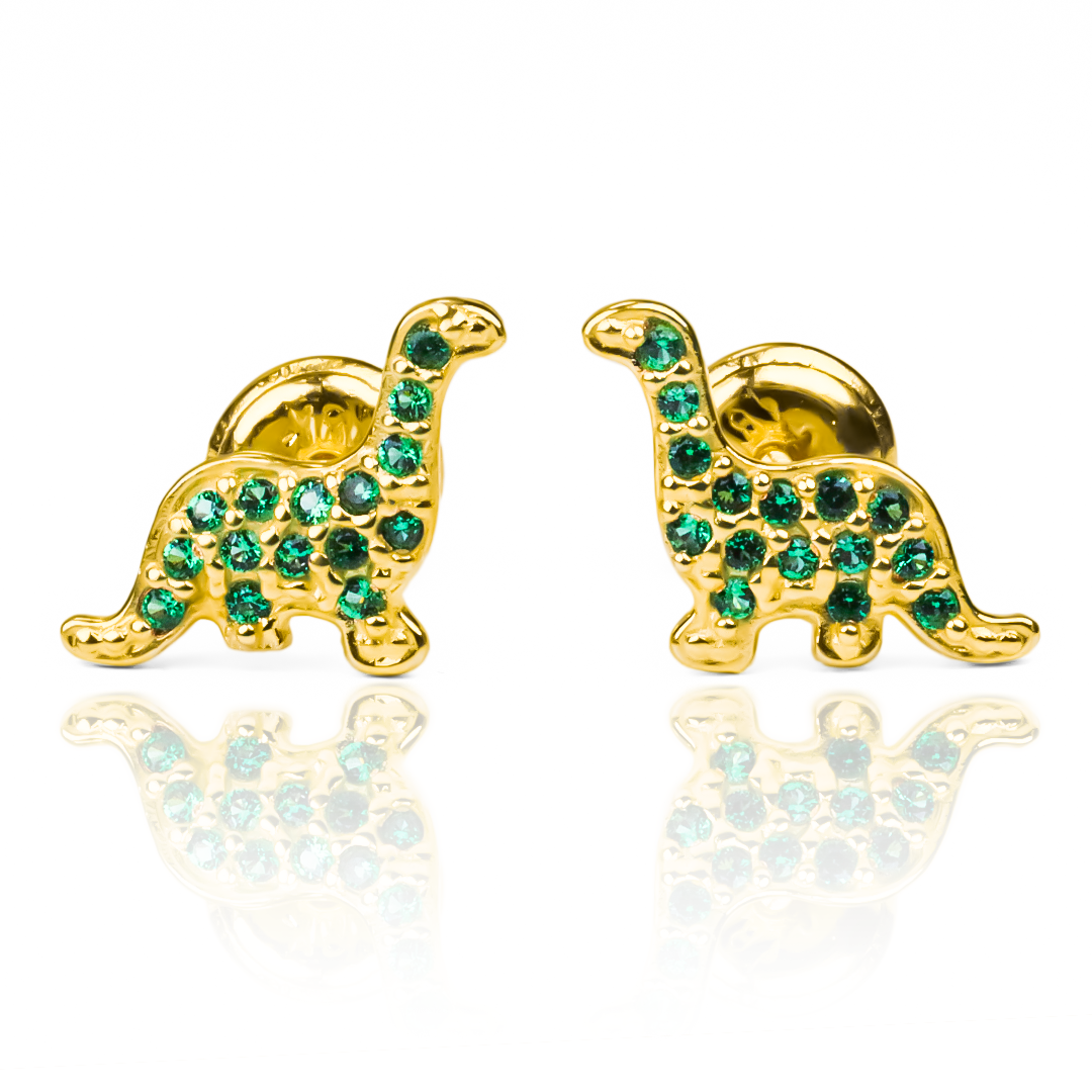 Con estos Topitos Dinosaurios Green de oro de 18K podrás llevar contigo un pedacito de la exclusiva joyería Caracas. Con su garantía para toda la vida, podrás lucir estos elegantes y sofisticados topitos en cualquier ocasión. Haz una declaración de estilo y sofisticación con esta pieza única.