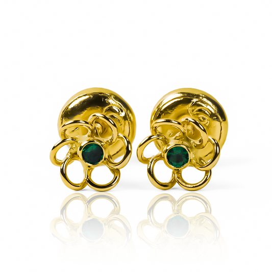 Los delicados Topitos Flor calada centro de cristal 6 aros S green, acompañados de Oro 18K y con la exclusividad de Joyería Caracas, son la perfecta combinación de elegancia y durabilidad. Con garantía para toda la vida, esta pieza es una verdadera joya para atesorar.