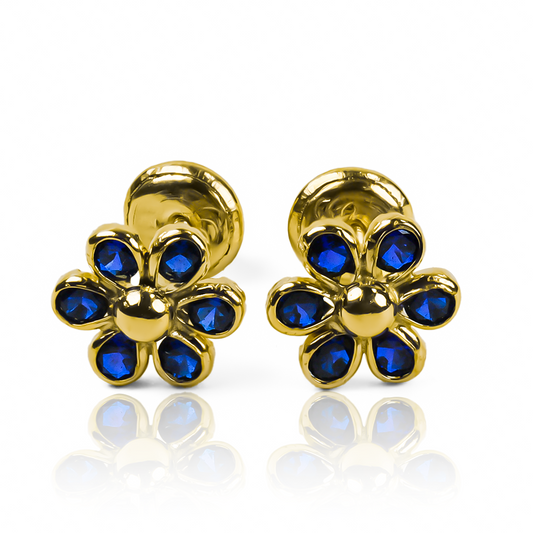 Recibe miradas de envidia con los Topitos Flor de cristal 6 pétalos - Blue. Elaborados con Oro 18K, estos exclusivos accesorios de Joyería Caracas te aseguran elegancia y delicadeza en todo momento. Además, cuentan con una garantía para toda la vida, asegurando su calidad y durabilidad.