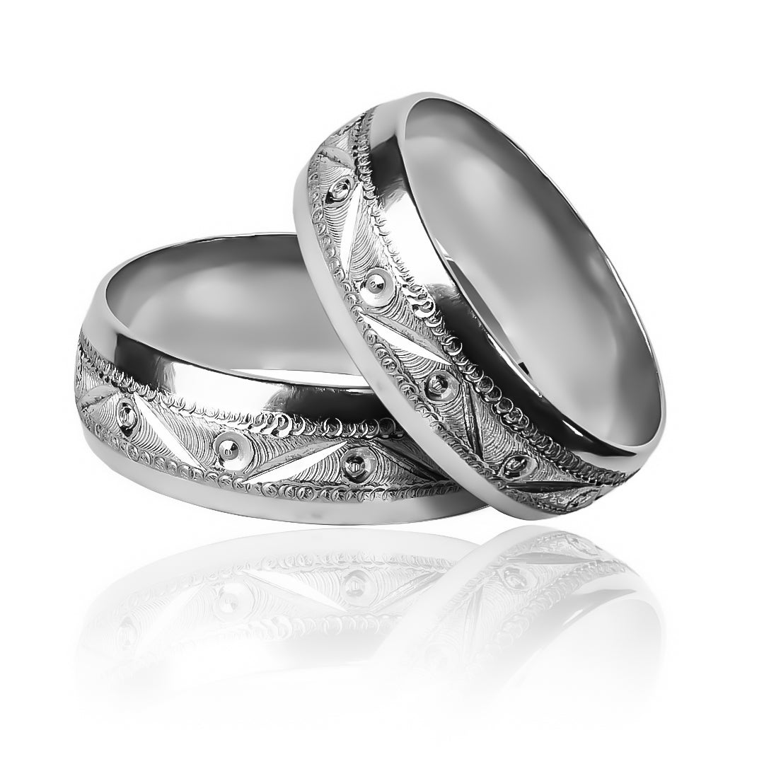 Two-tone faceted wedding rings