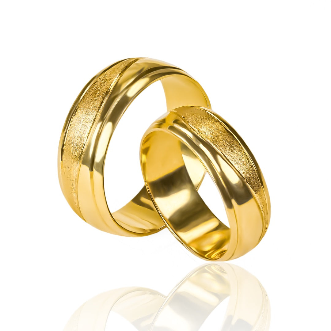 anillos de boda Atlantis Mitad Mate + Bisel de Joyería Caracas, hechos con oro de 18 quilates de la más alta calidad y con certificación garantizada.