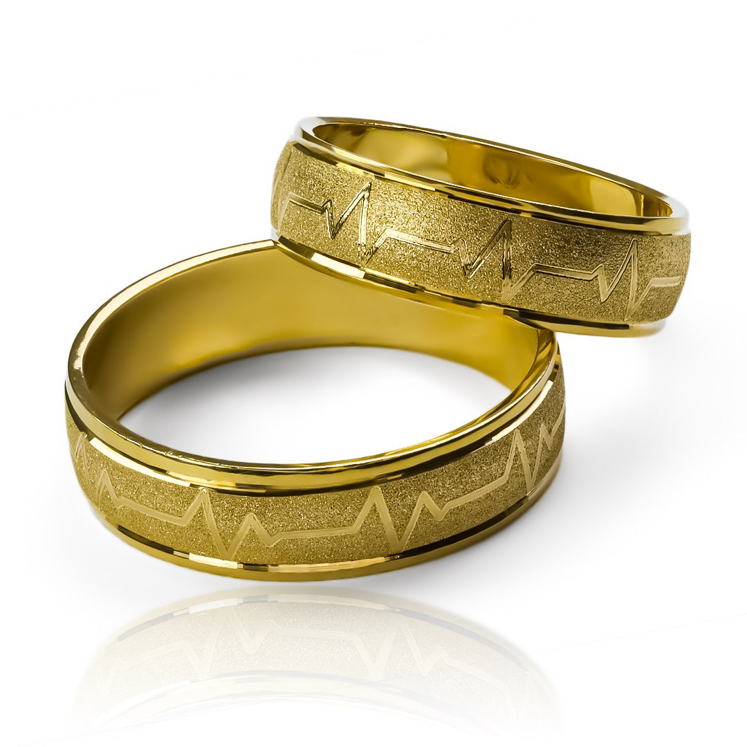 anillos de boda Latidos Mate de Joyería Caracas. Hechos de oro de 18 quilates con un acabado mate, estos anillos son el símbolo perfecto de amor y compromiso. Cada anillo viene con un certificado de calidad