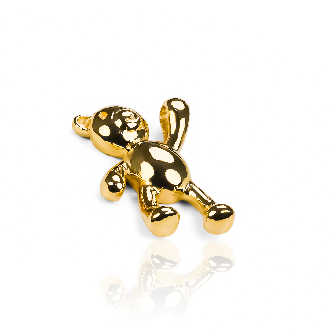 Este delicado Dije Teddy L JC es un accesorio de joyería de lujo con detalles en oro 18K y una garantía para toda la vida. Resaltará tu elegancia y sofisticación, ¡perfecto para cualquier ocasión! Diseñado por Joyería Caracas, una marca exclusiva que te llevará al siguiente nivel de estilo.